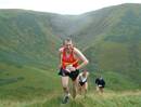 Brian Howie reaches the cairn by the road