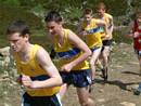 a bunch of yellow vests in the junior race