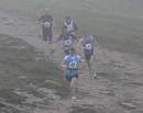 The first three men pass Edel Mooney and Susan Ridley  not far from the finish