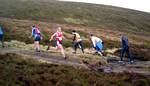 Steven Fallon whizzes past  a line of ascenders