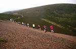 The slope eases before the last climb to the cairn