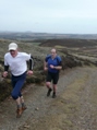 Organiser Keith Burns being chased by Willie Gibson on the climb of Lammer Law