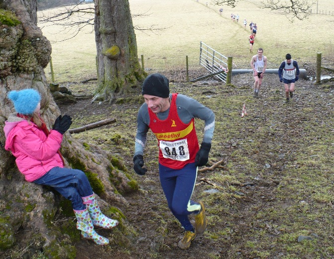 Gordon is cheered on by a young admirer (who couldn't believe how fast the runners were going!)