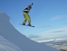 Snow boarder starts descent from Caerketton summit