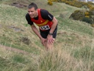 Derek Paton climbs onto the crags