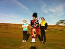 Linda and Margaret with Joe, the Lone Piper.